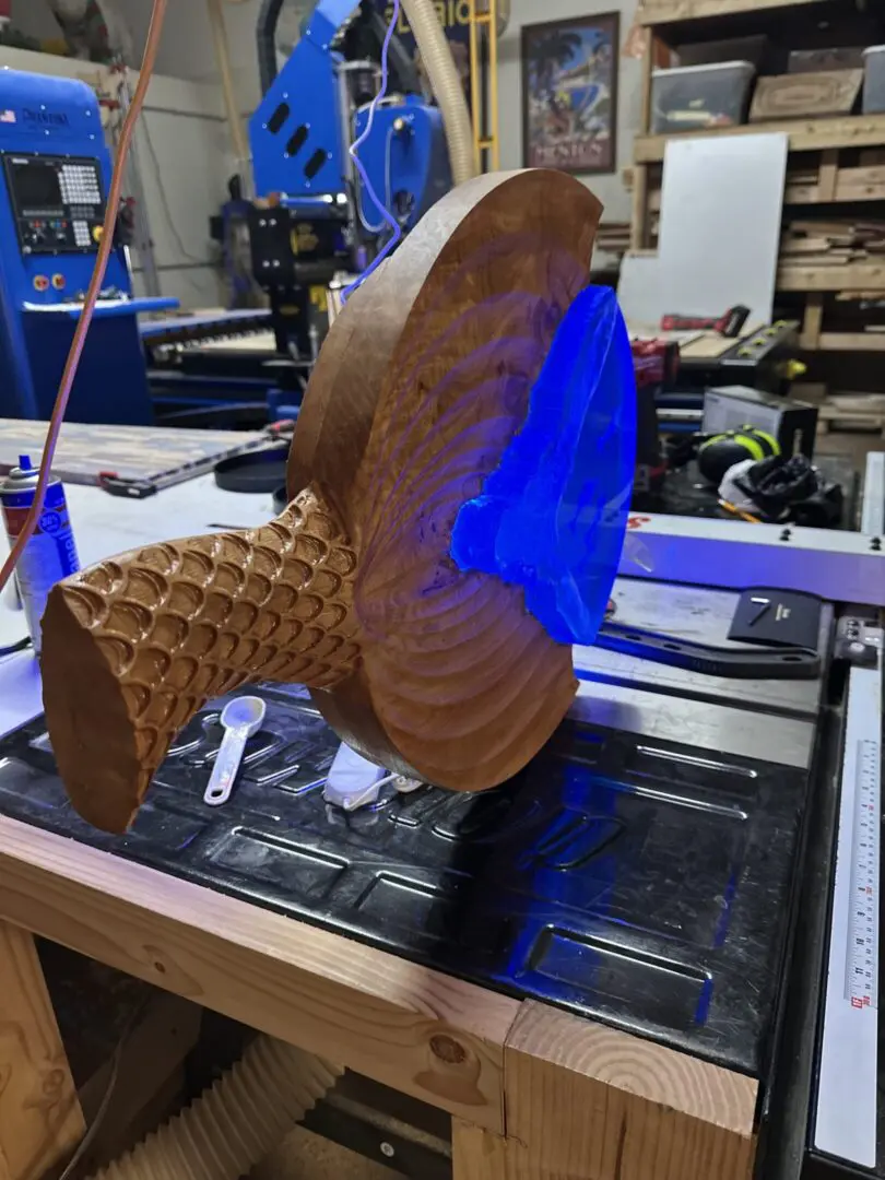 Wooden mushroom sculpture with blue resin filling