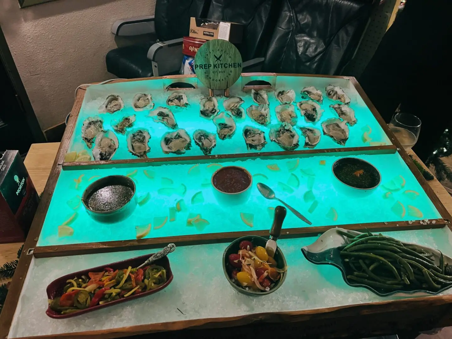 Fresh oysters on ice with condiments