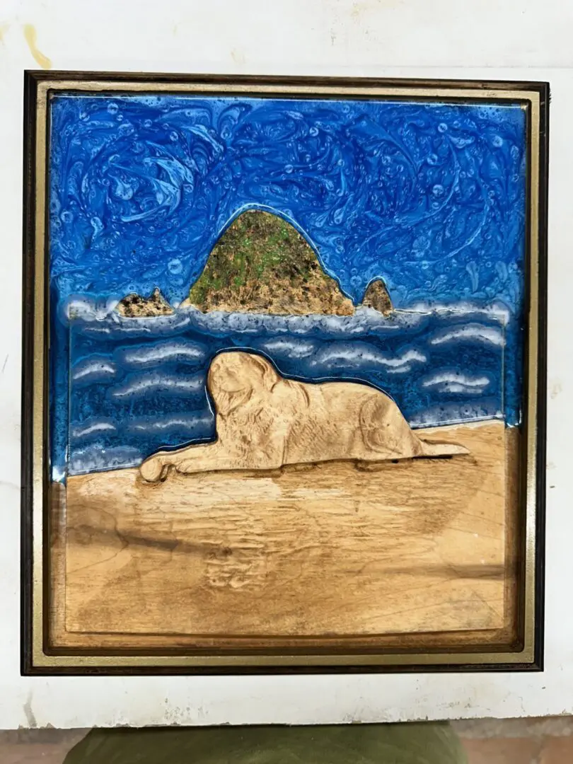 Wood and resin framed sea lion artwork