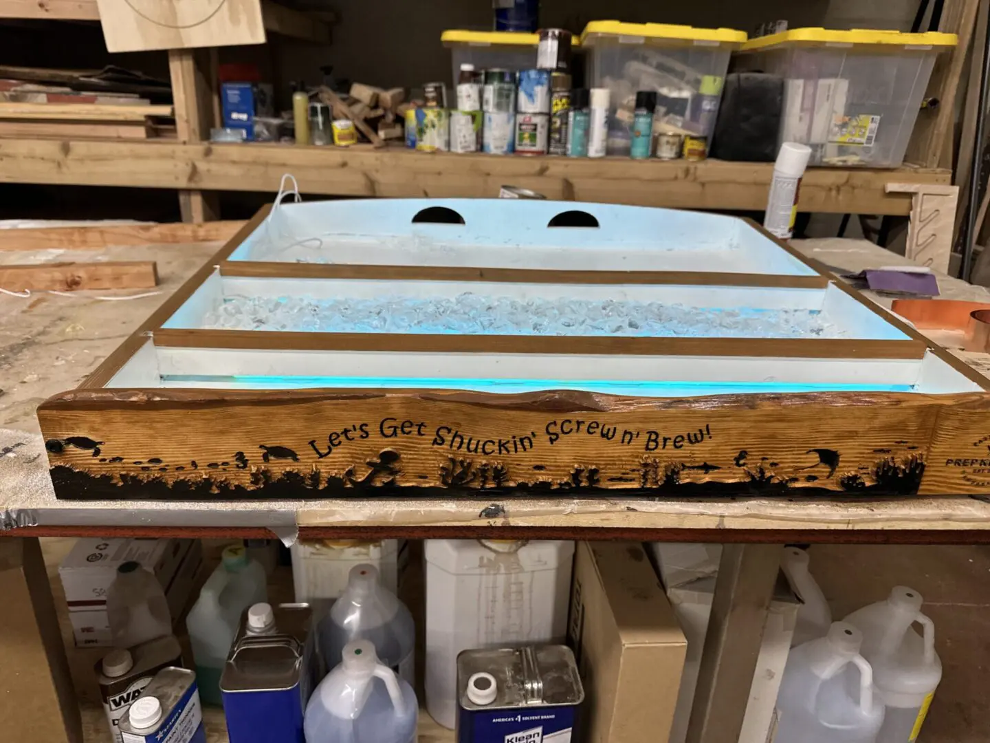 Wooden display tray with blue resin waves
