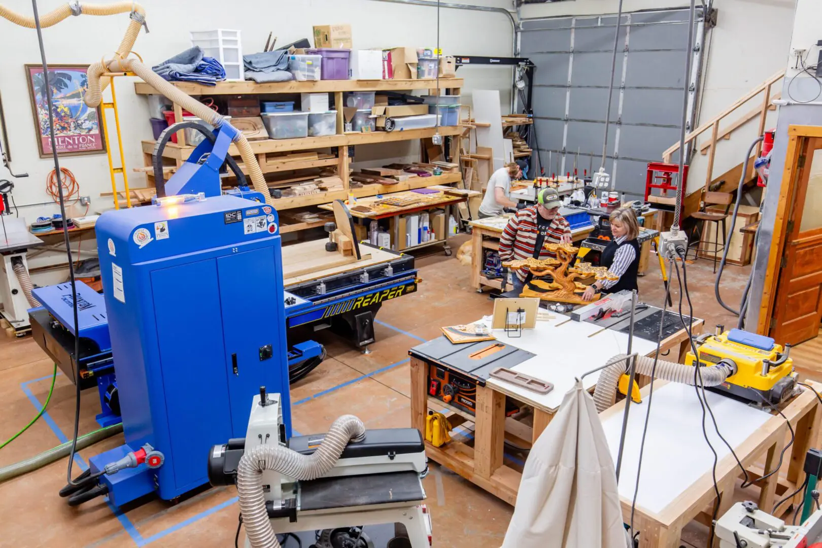 Woodshop with machinery and two people