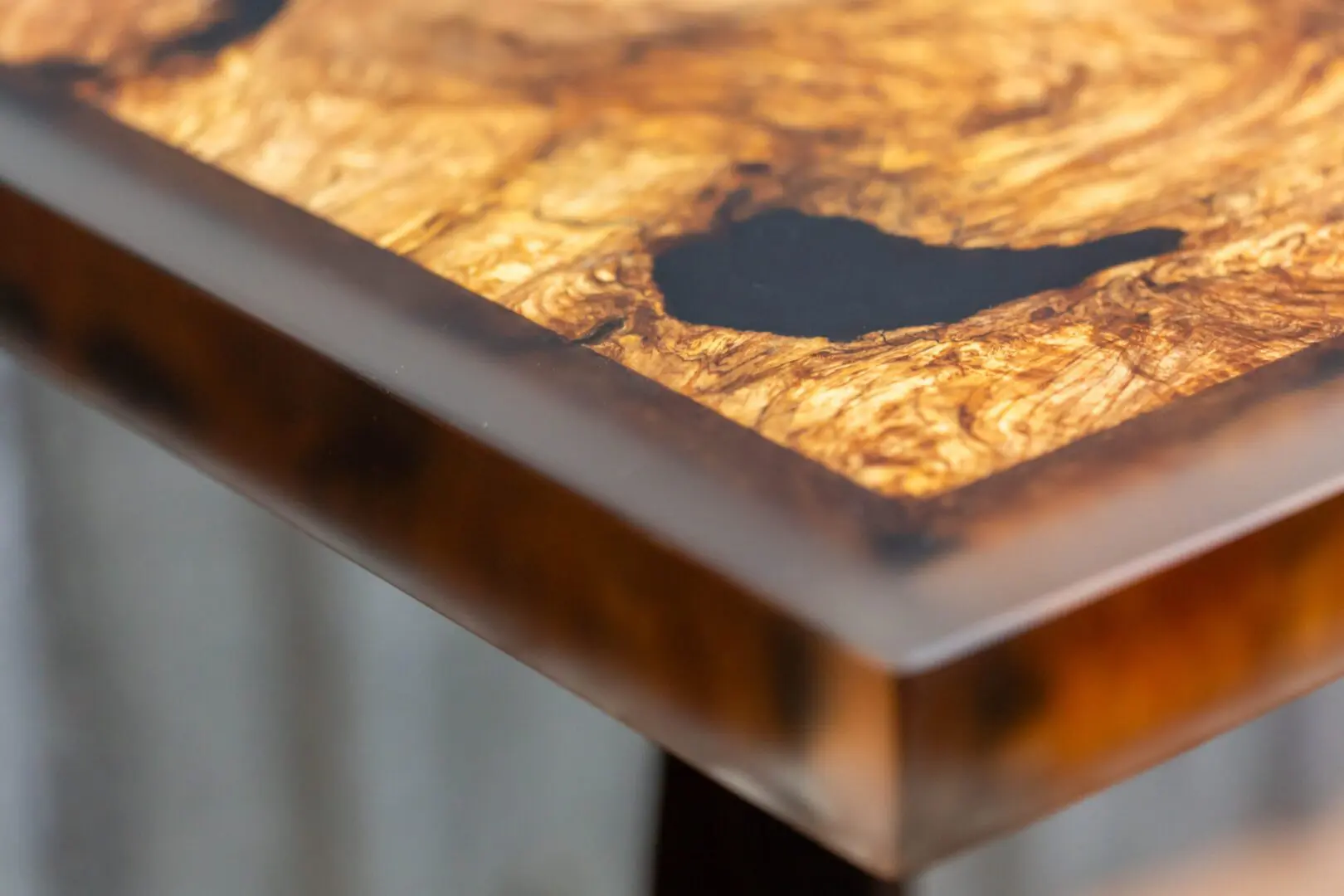 Burl wood table with amber epoxy inlay