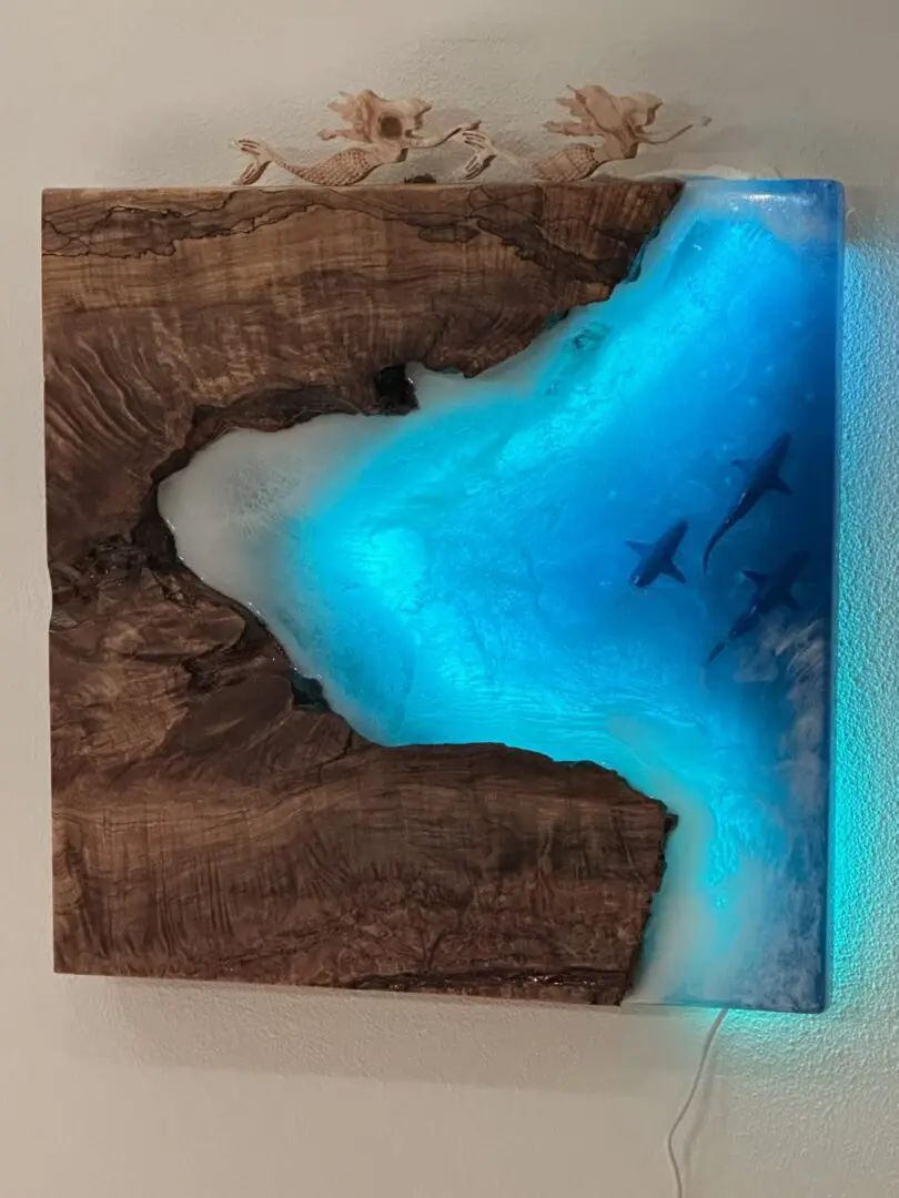 Wood and blue resin wall art with sharks